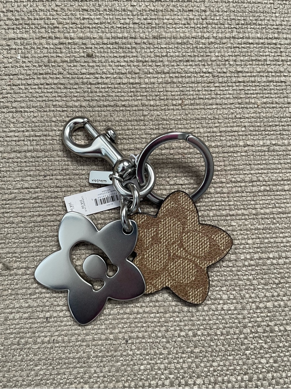 Coach Wildflower Signature Canvas Bag Charm in colour silver/tan
